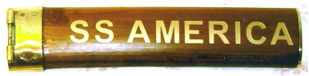 Section of teak handrail, restored and with ship's name added by careful carving