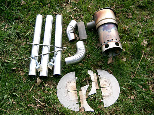 Alle Teile:  Abgasrohre mit Bgen, Halterungen, feuerfestes Untergestell  